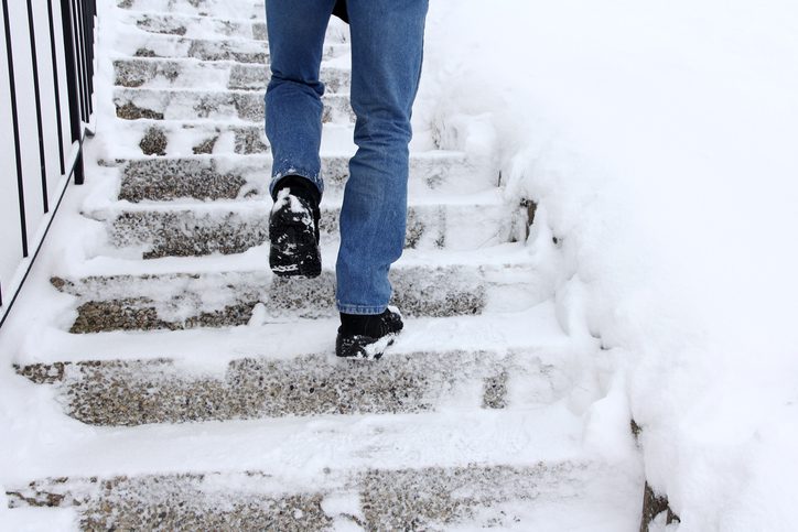 slip and fall risk on snowy stairs