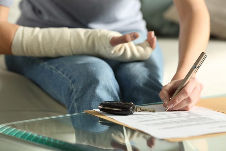 injured person signing a document
