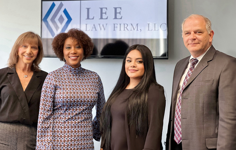 team in front of tv sign